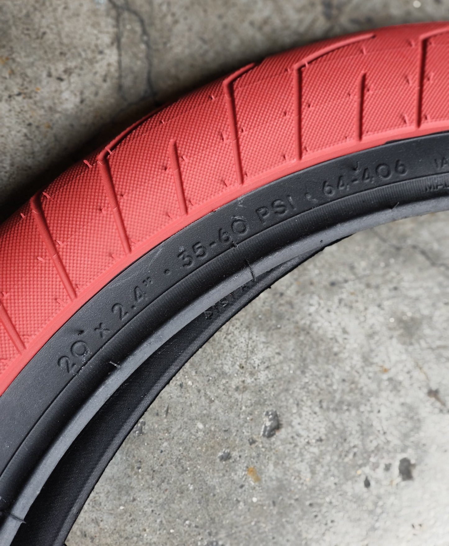 Kink BMX, Tire Sever 20 x 2.40, Red w/ Black walls (sold by pair)